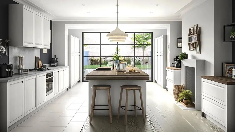 White shaker kitchen with crisp baseboard trim and light wood flooring
