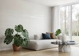 Modern minimalist living room with monstera and oak flooring
