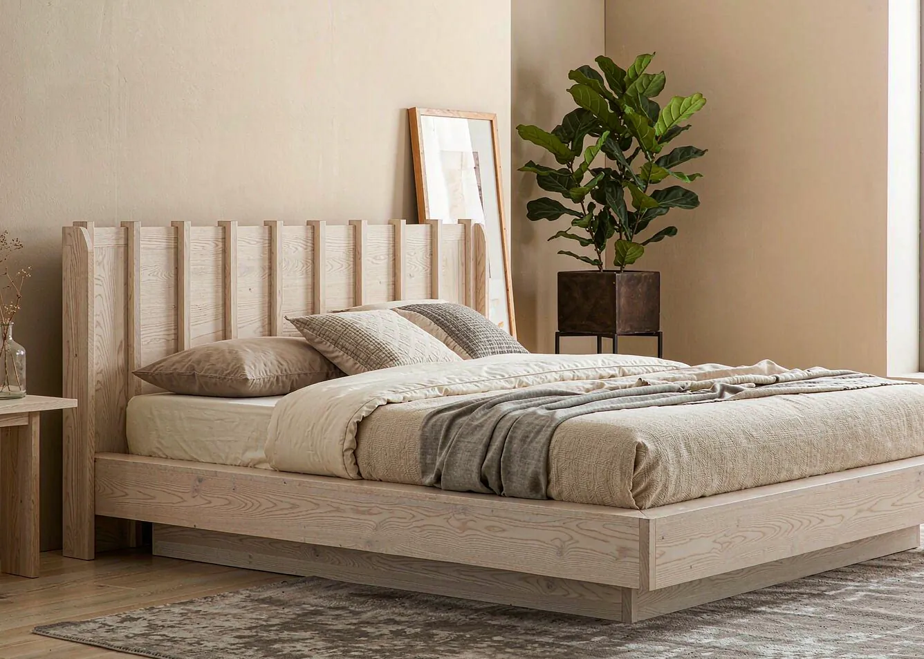 Modern neutral bedroom with oak bed and fiddle-leaf fig