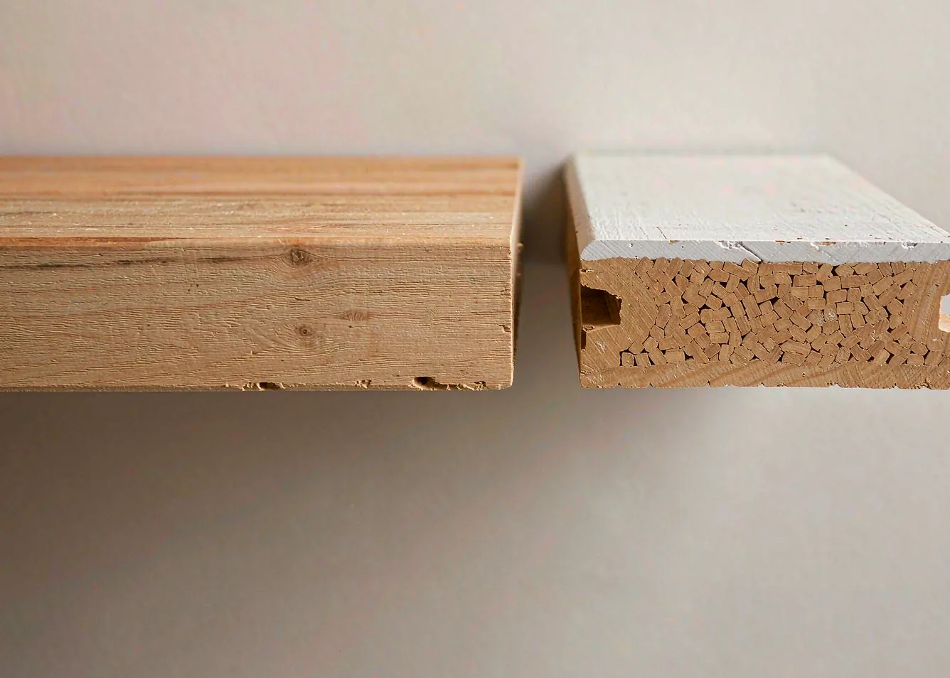 Side-by-side cross-section of natural wood plank versus capped composite board