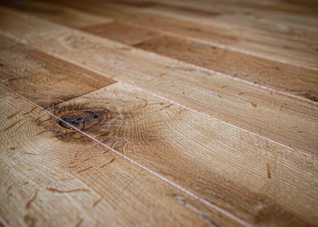 Close-up of natural oak hardwood floor grain and knots