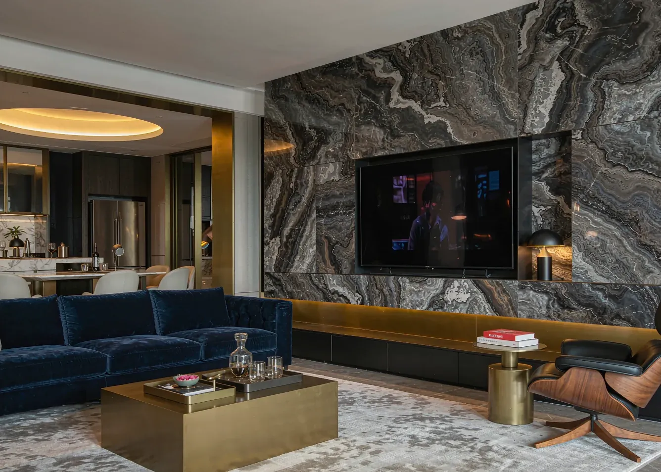 Modern luxury living room with marble wall and brass accents