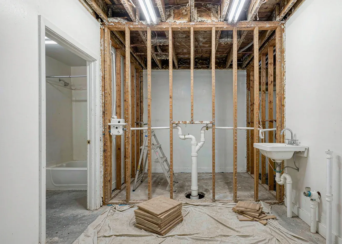 Interior gutted during renovation to combine rooms into an open floor plan