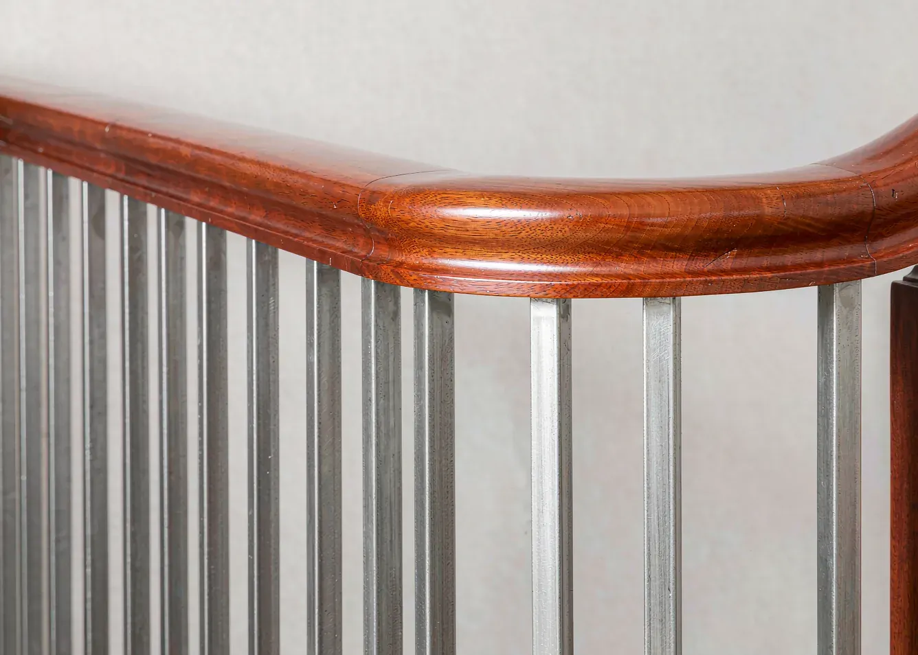 Wood handrail with metal balusters and newel post detail