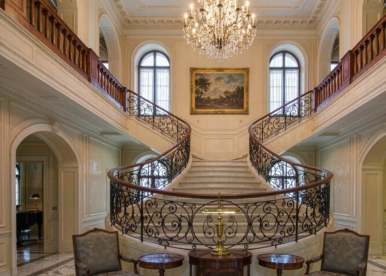 Curved spiral staircase with wrought iron railing