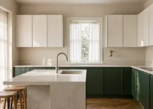 modern kitchen with custom two-tone white oak and deep green cabinets and quartz island