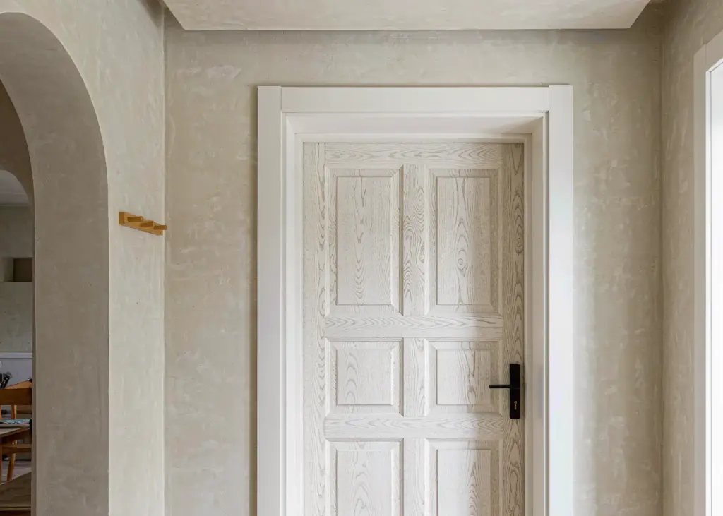 modern white oak prehung 36 inch door in a bright minimalist interior