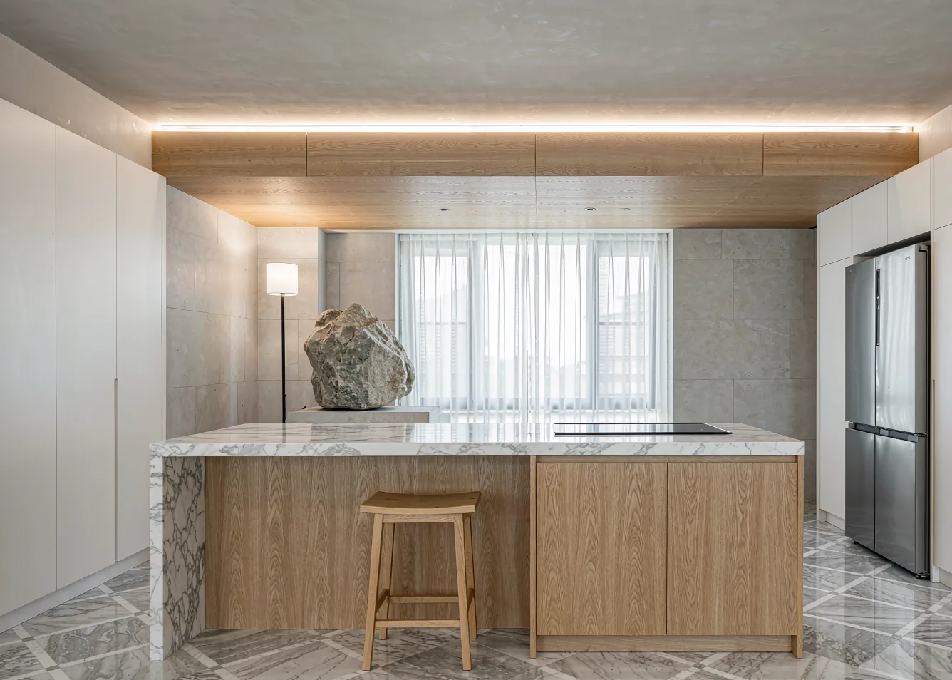 Modern minimalist kitchen with induction cooktop and LED lighting