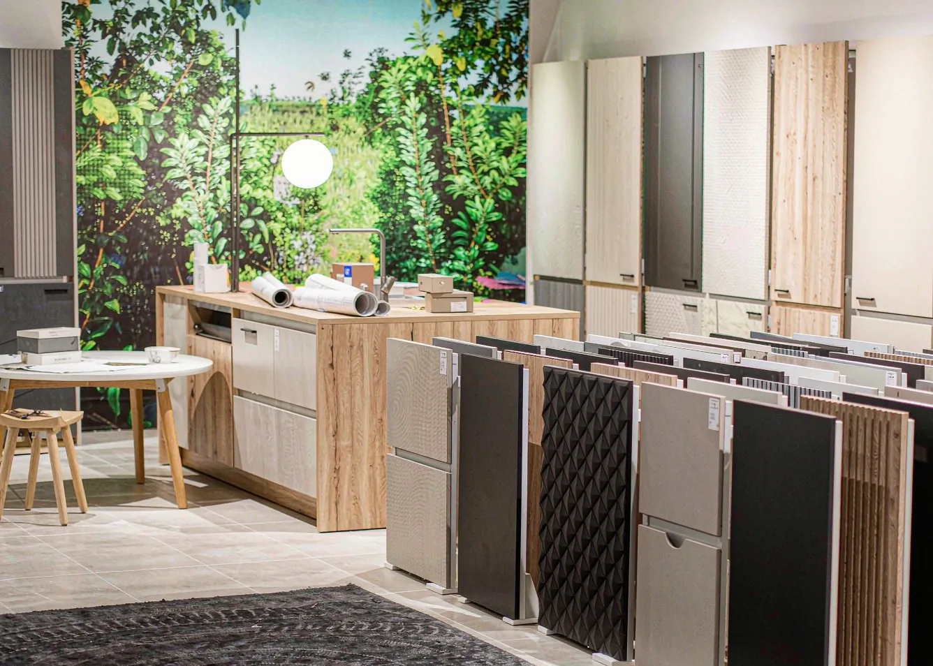 clean modern cabinet showroom with sample kitchen fronts in different finishes